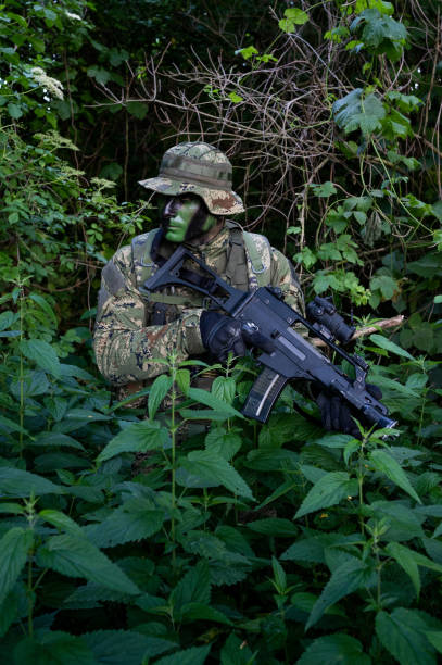 istock Recon unit soldier in his forest camoflauge 1291781953