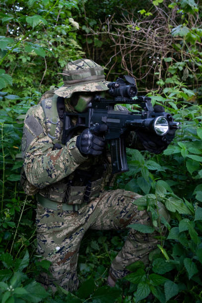 istock Recon unit soldier in his forest camoflauge 1291781958