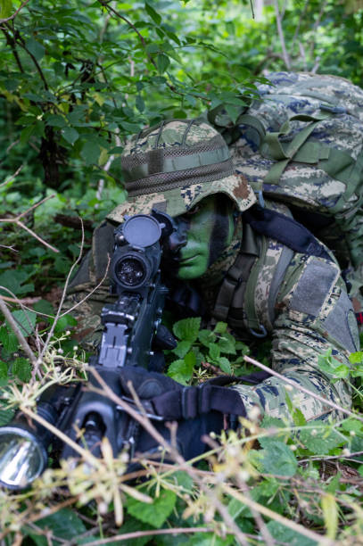 istock Recon unit soldier in his forest camoflauge 1291781960