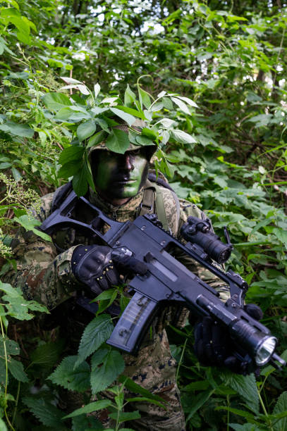istock Recon unit soldier in his forest camoflauge 1291781969