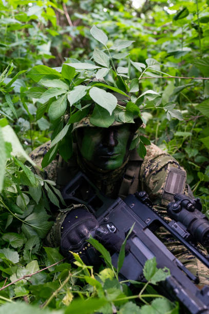 istock Recon unit soldier in his forest camoflauge 1291781973