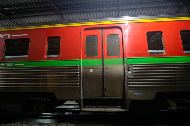 istock The old train stops at railway station train, Night light. 1291782020