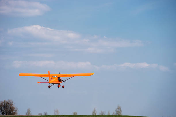 istock Small charter aircraft flying in a blue sky 1291784344