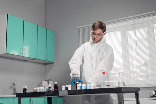 istock A clinician studying a new substance in a laboratory. Young handsome chemist working in the lab 1291784935