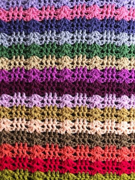 istock Close up texture background of a colourful crochet blanket 1291788221