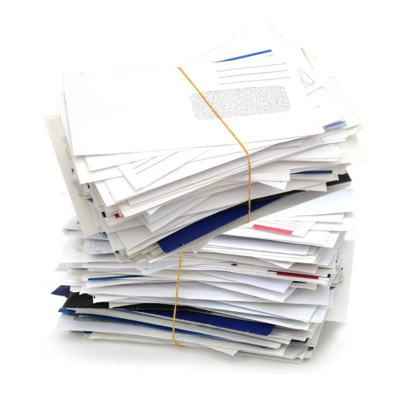 istock Stacking of letter mails on white 1291788279
