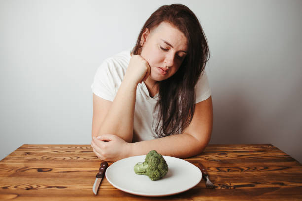 istock Sad overweight woman dealing with anorexia 1291788897