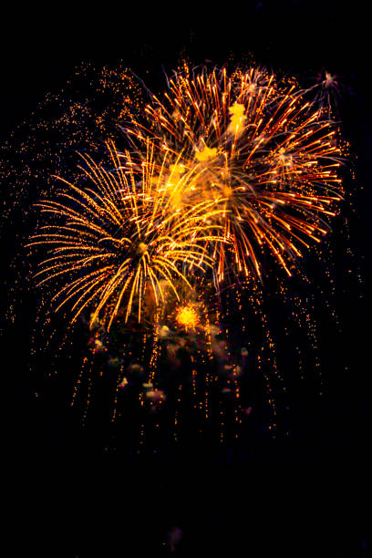 istock Fireworks light up  at New Year Eve. Abstract Festive background with fireworks sparkles. Copyspace
