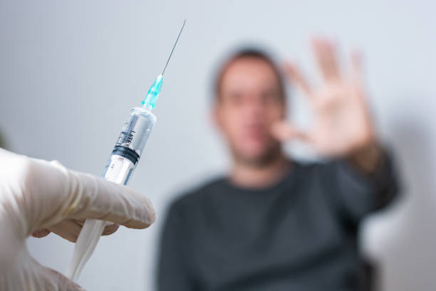 istock Man refuses to receive the vaccine 1291791836