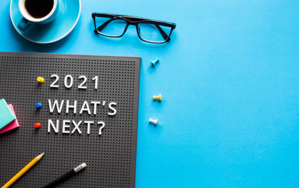 istock 2021 What's next ? text on work table.trends research and new things.business startup 1291792246