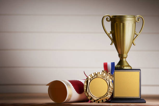 istock golden trophy and medal with certificate 1291793382