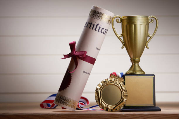 golden trophy and medal with certificate
