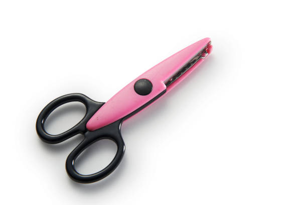 istock black and pink zigzag scissor isolate on white background. Clipping path. 1291793817