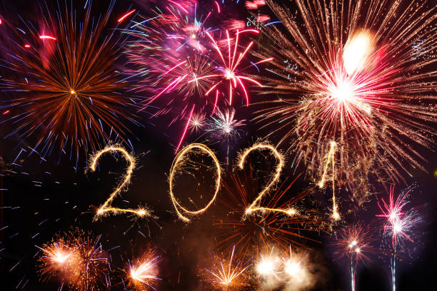 istock 2021 Happy New Year written with Sparkle firework on black background 1291794862