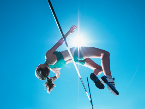 Atleta compensación salto de altura femenino photo