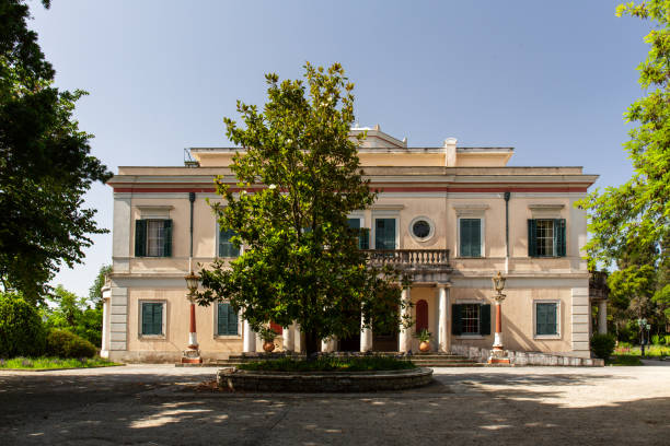 Mon Repos Small Castle in Kerkyra, Corfu Kerkyra Korfu, Greece
June, 2019
The neoclassical castle was built between 1828 and 1832 on behalf of the English Governor of the Ionian Republic Sir Frederick Adam, to whom it served as a summer residence from 1831. After the end of the British Protectorate and the unification of the Ionian Islands with the Kingdom of Greece in 1864, the site was left for use by the Greek royal family and was given its present name. The last time King Constantine II lived in the castle was before he went into exile in 1967. It stood empty for a long time; it was not until 1994 that the site was awarded to the Greek State in a dispute before the European Court of Justice. The castle has been renovated and the park is open to visitors.

The castle now houses a museum. Mon Repos is best known for the birth of Prince Philip, Duke of Edinburgh, in 1921. prince phillip stock pictures, royalty-free photos & images