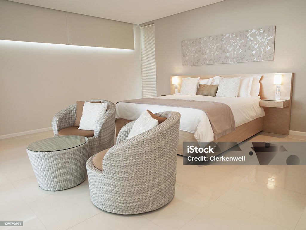 Modern bedroom in luxurious apartment  Bedroom Stock Photo