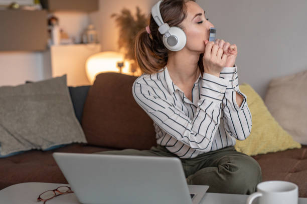 istock Young woman with credit card ordering online 1291799203