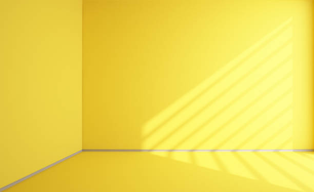 istock Empty yellow room with light from a window with shadows from blinds, color 2021.3d rendering 1291800421