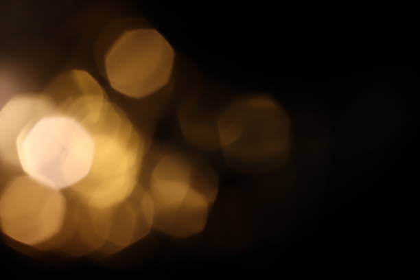 istock bokeh warm light on black background overlay 1291800648