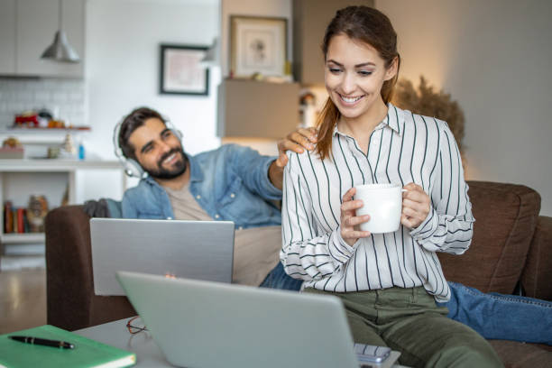istock Couple working together from home on the laptop 1291800806