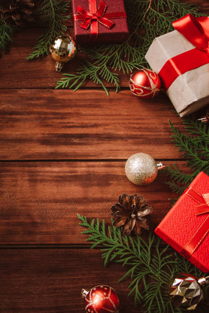 istock Christmas composition on wooden background. Gift boxes and festive decor. 1291801658