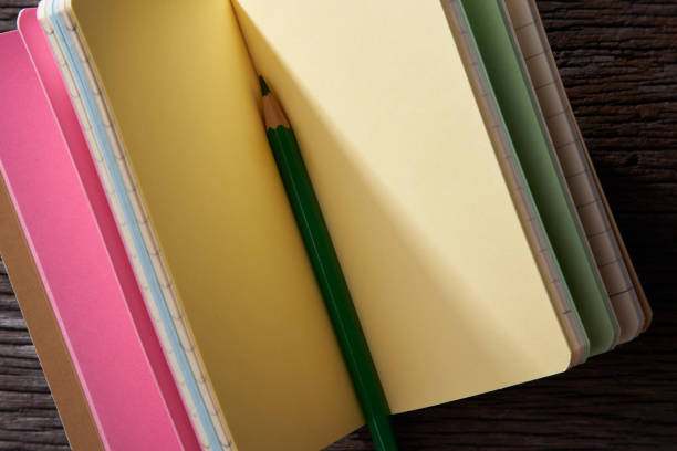 istock colorful note book and pencils 1291802407