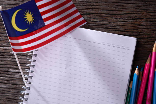 istock blank note book with Malaysian flag at the background 1291803380