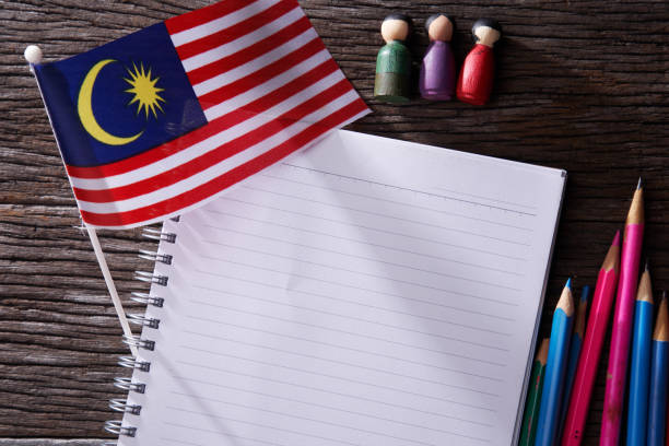 istock blank note book with Malaysian flag at the background 1291803384