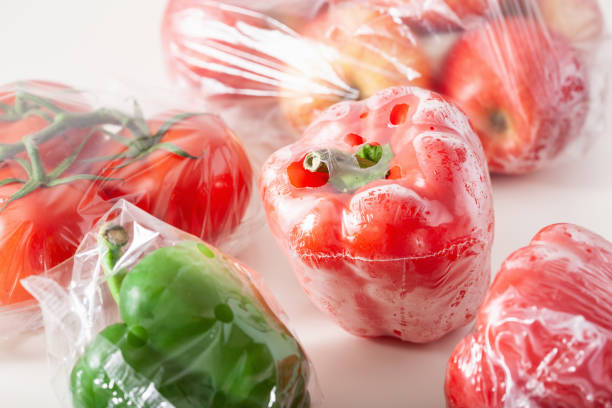 istock single use plastic packaging issue. peppers tomatoes apples vegetables in plastic bags 1291803641