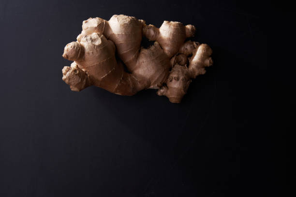 istock close up of ginger root on blackboard 1291806202