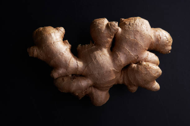 istock close up of ginger root on blackboard 1291806233