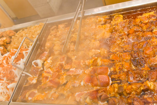 istock Large steaming pan with delicious shish kebabs 1291807807