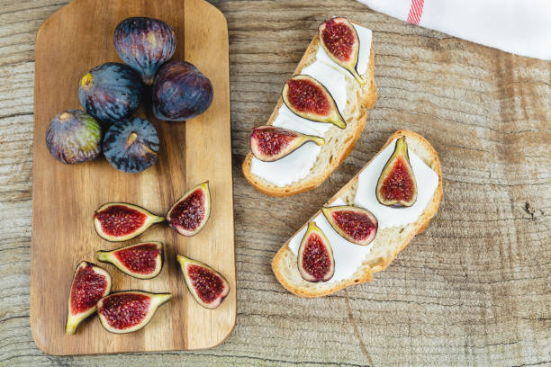 istock Figs with fresh cheese on toast. Copy space. 1291809901