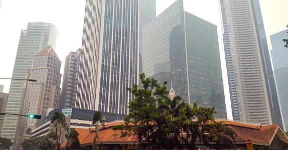 In september 2015, Singapore skyscrapers were sourrounded by a fog because forests were burning in southeast asia with lots of pollution as a result.