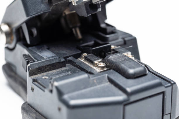 istock Optical fiber cutter for subsequent splice, close-up on white 1291814198