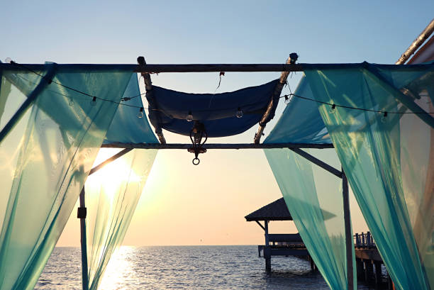 istock Romantic Tent on the Beach against Gorgeous Sunset 1291815613