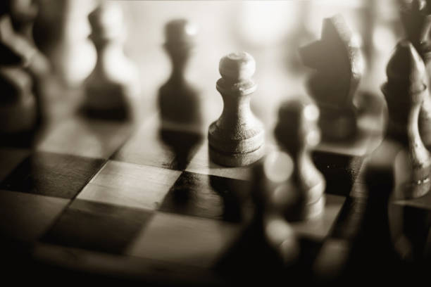 istock Wooden chess pieces on the chessboard. Intellectual game -chess. 1291819389