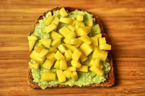 istock Home made sandwich Avocado mango for healthy breakfast snack. Proper nutrition. 1291819612