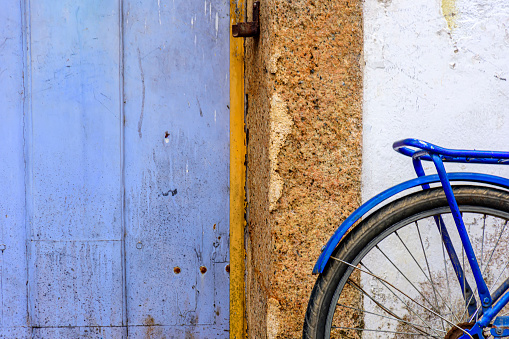 Detail of old bicycle stops in front of the historic house in the city of Paraty, south coast of Rio de Janeiro, Brazil
