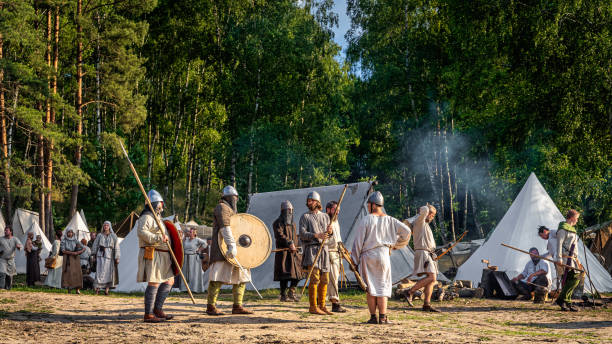Historical reenactment of Slavic or Vikings tribe lifestyle in a tent camp from 11th century Cedynia Poland June 2019 Historical reenactment of Slavic or Vikings tribe lifestyle with warriors and villagers in a tent camp from 11th century military camp stock pictures, royalty-free photos & images