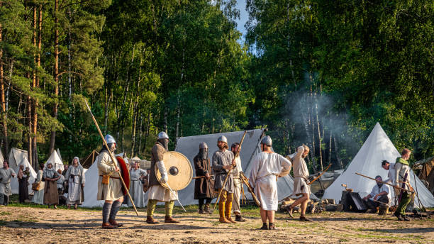 historical reenactment of slavic or vikings tribe lifestyle in a tent camp from 11th century - history knight historical reenactment military imagens e fotografias de stock