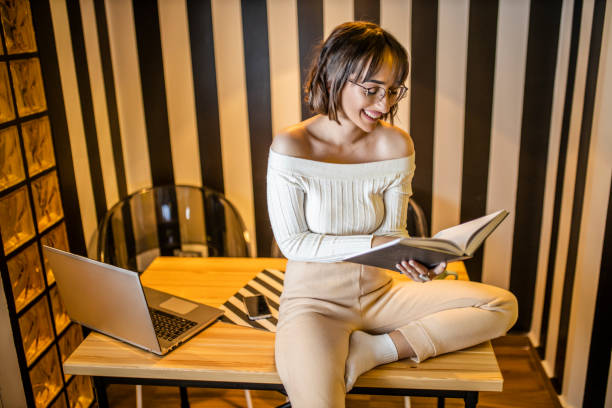 istock Young beautiful female student learning at her home 1291826790