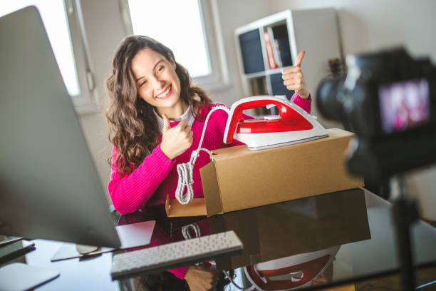 istock Young female influencer making a tutorial of new iron 1291829449