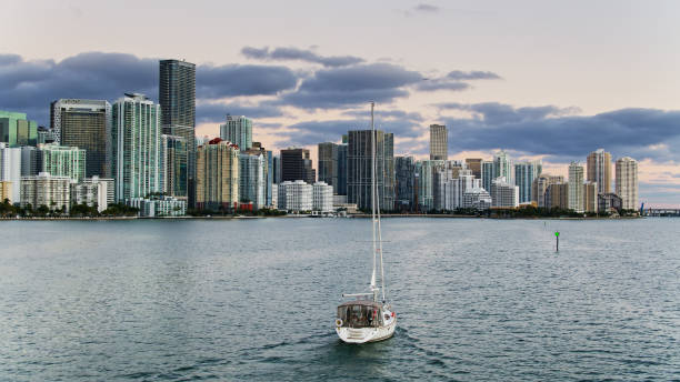 istock Sailboat Approaching Miami Skyline at Dawn - Aerial 1291829767