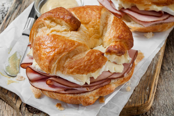 istock Ham and Brie Croissant Sandwiches with Dijon Mustard 1291832983