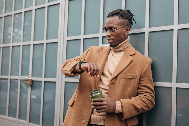 istock One handsome African-american man checking the time on his wristwatch 1291833193