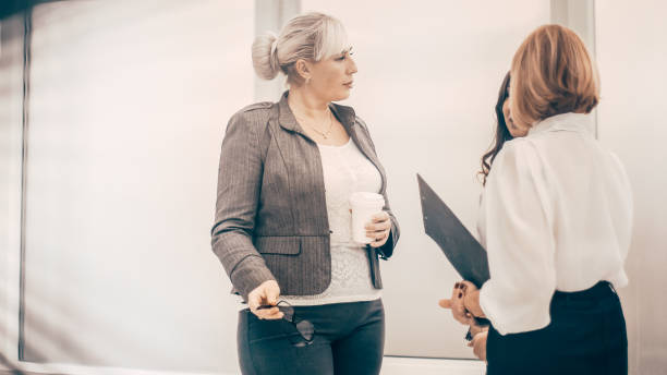 istock close up. qualified employees discussing business documents 1291833943
