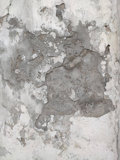 istock Grey Concrete Texture old wall with peeling paint, scratches and cracks 1291836662