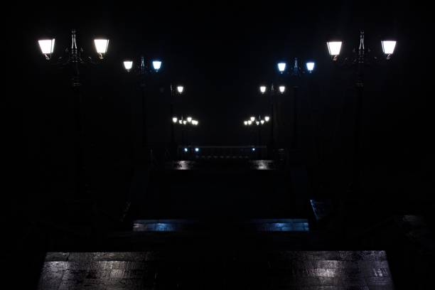 istock lanterns in park on stairs that going down in the dark 1291836824